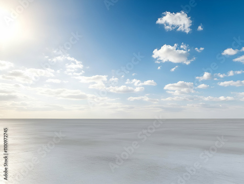 Serene ocean view under a sunny blue sky.