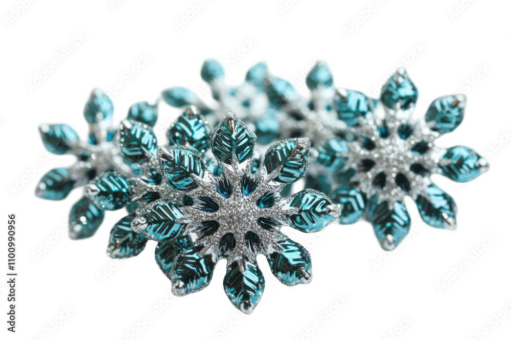 A decorative arrangement of teal and silver snowflake ornaments. A decorative arrangement of teal and silver snowflake ornaments.