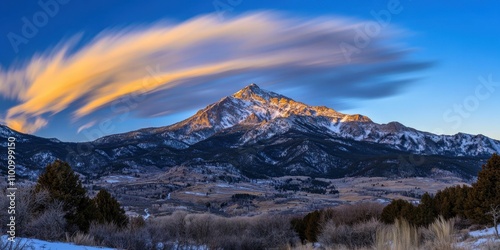 Soft cloud streaks Frozen mountain peak Time-lapse of