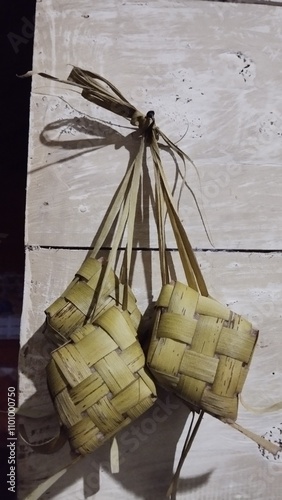  Ketupat is a traditional food that is commonly found in Indonesia, Malaysia and several other Southeast Asian countries, especially during holiday celebrations such as Eid al-Fitr. Ketupat is made by photo