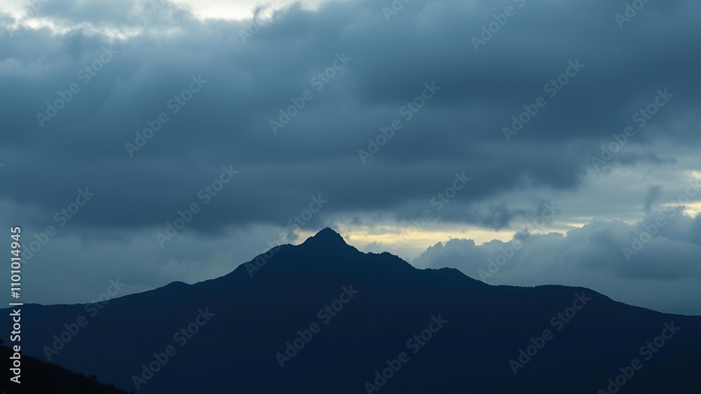 Silhouetted mountain ridge against a cloudy sky, mountains, seclusion Silhouetted mountain ridge against a cloudy sky, mountains, seclusion