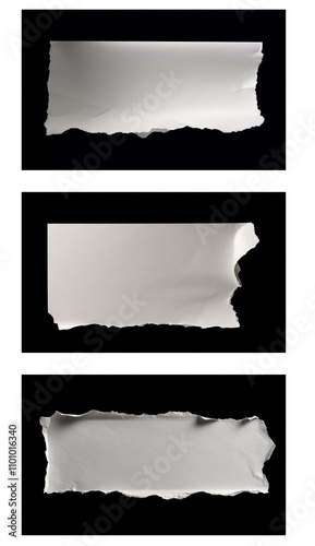 Torn Paper Edges Revealing Blank Space Against a Dark Background in Three Sections photo