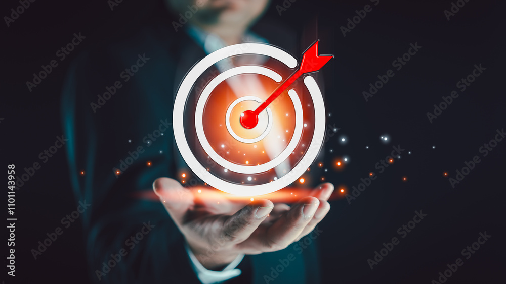 Fototapeta premium Concept of business strategy and future sustainable business action plan. Hand holding target board for creative objective target and success and business goals concept. Goal setting concept