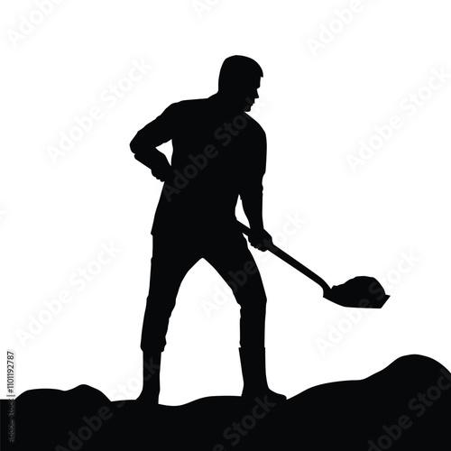 Silhouette of a man using a shovel to dig the ground