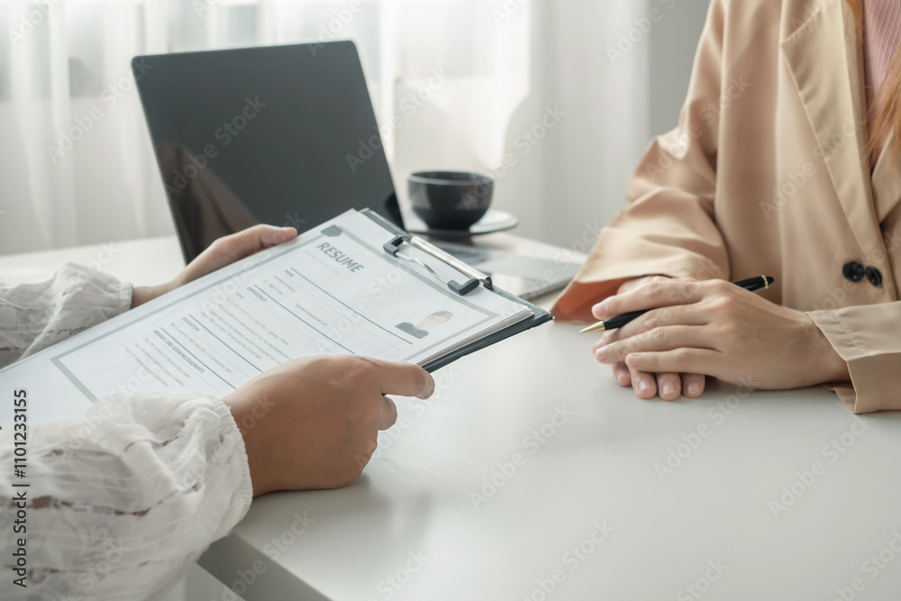Fototapeta premium Business people hold a resume and talk to job applicants for job interviews about careers and Their personal history in the company. Recruitment concepts