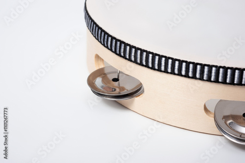 Tambourine is a percussion musical instrument, shot on a white background.