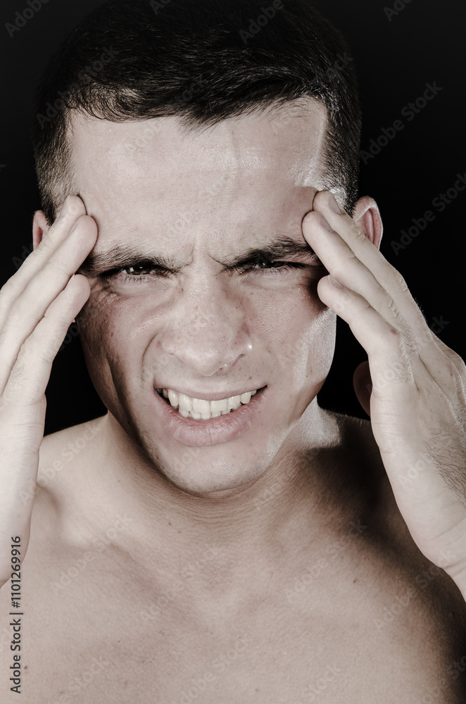 Fototapeta premium Health issues. Young attractive man and headache.