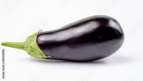 One fresh raw healthy eggplant or aubergine vegetable isolated on white background. Food ingredient, vegetatian cuisine, organic greenhouse farm plant.