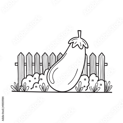 An eggplant growing in a garden near a wooden fence