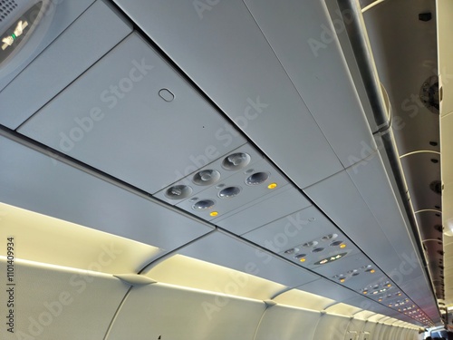 Ceiling, ventilation and luggage compartment of the airplane. Aircraft interior.