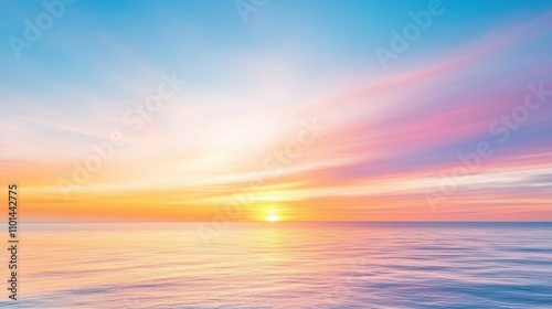 A stunning sunrise over the calm sea, showcasing vibrant hues of orange, pink, and blue in the sky, reflecting beautifully on the water's surface.