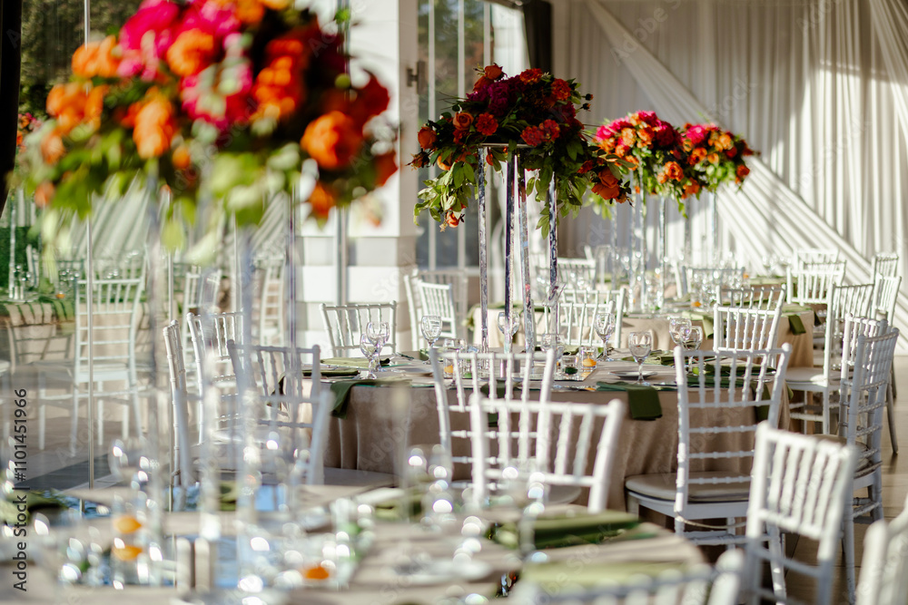 Outdoor Wedding Reception with Tall Floral Centerpieces