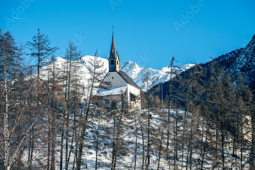 Bell tower of the ancient disappeared village of Curon. Lake Resia in winter. photo