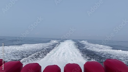 Waves from the engines of a high-speed boat. Rear view. Fast boat with seven engines.
