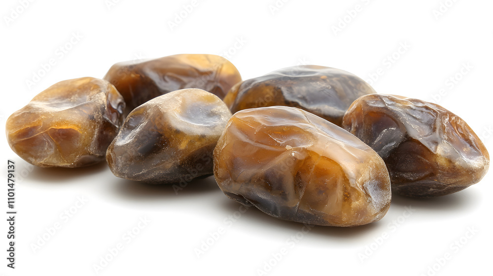 Close-up of five moist, dark brown dates isolated on a white background. The dates are plump and glistening, showcasing their natural texture. Close-up of five moist, dark brown dates isolated on a white background. The dates are plump and glistening, showcasing their natural texture.