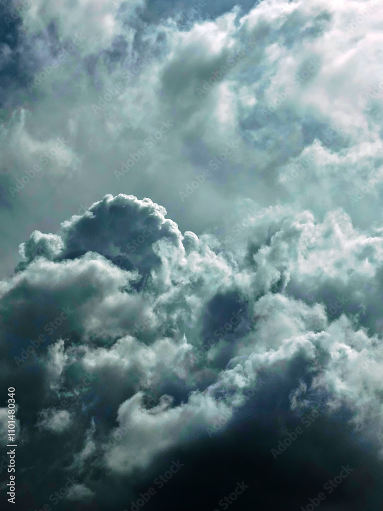Thick dark clouds move quickly blown by the wind before heavy rain. Copy space. Background Thick dark clouds move quickly blown by the wind before heavy rain. Copy space. Background