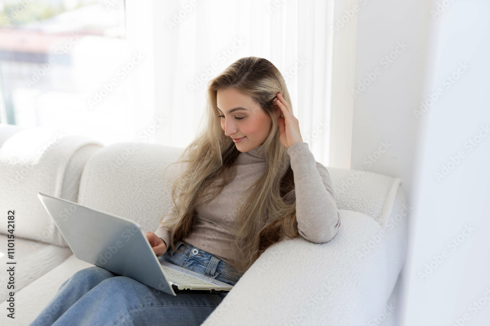happy young businesswoman with laptop on comfortable sofa happy young businesswoman with laptop on comfortable sofa