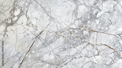 Elegant white marble surface adorned with intricate gray veining and subtle gold highlights, perfect for luxurious design applications.