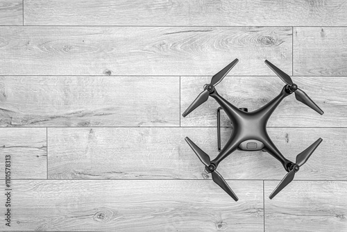 Dark drone on wooden background. Monochrome shot.