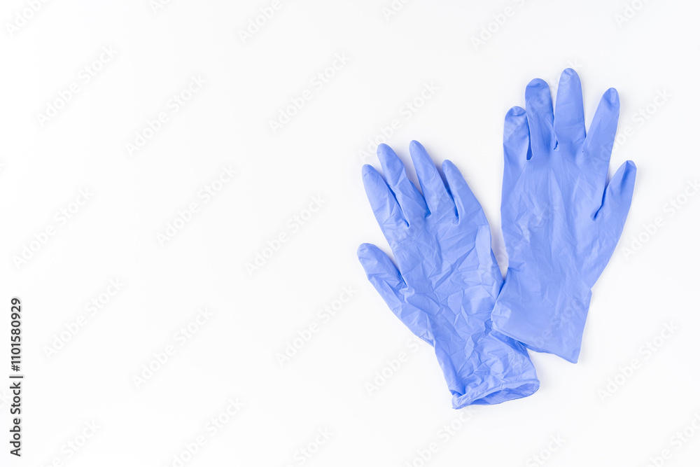 Blue latex gloves on white background. Top view