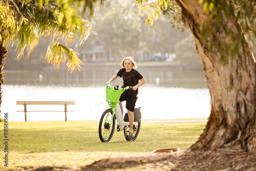 Teenage boy riding public motorised bike in Gold Coast park