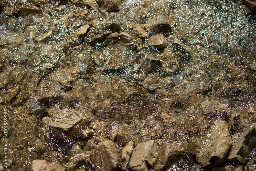 A rocky shore with water splashing over the rocks A rocky shore with water splashing over the rocks