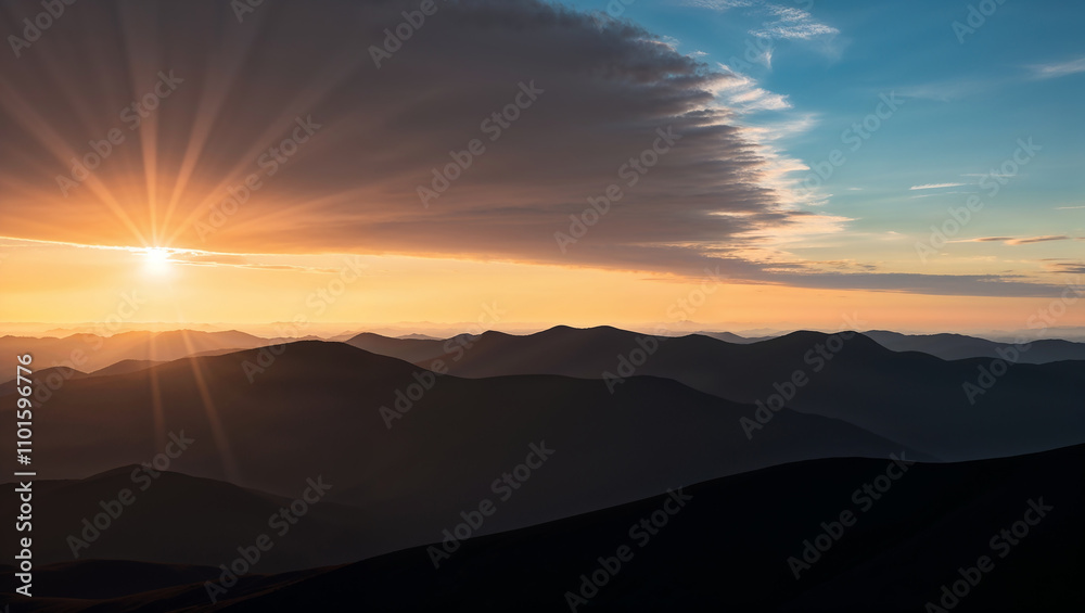 Sunset over mountain peaks with dramatic sky and shadows. Sunset over mountain peaks with dramatic sky and shadows.