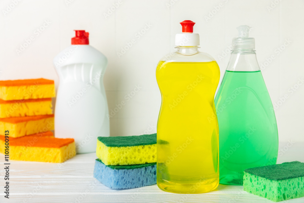 Colorful dish sponges on textured background. Kitchen sponge. Cleaning concept, cleaning service. Dishwashing liquid with clean and dirty dishes plate. Place for text, copy space. Wash the dishes. Colorful dish sponges on textured background. Kitchen sponge. Cleaning concept, cleaning service. Dishwashing liquid with clean and dirty dishes plate. Place for text, copy space. Wash the dishes.