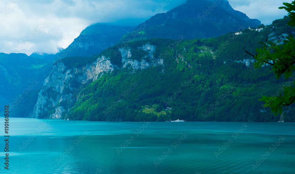 Vivid azure waters contrasting the rugged mountain backdrop creates a striking natural tableau, inviting exploration and the awe of the wilderness's untouched beauty.