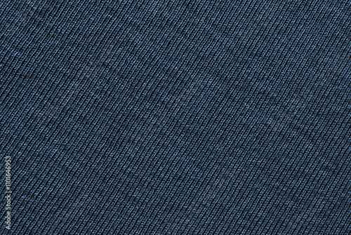 Dark blue jersey fabric pattern close up as background photo