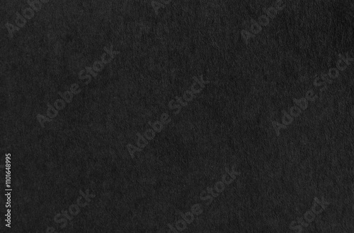 Black paper or cardboard texture as background