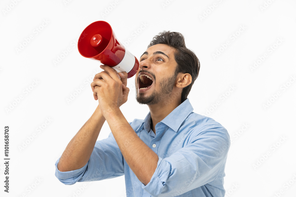 Excited businessman cheering and screaming through megaphone Excited businessman cheering and screaming through megaphone