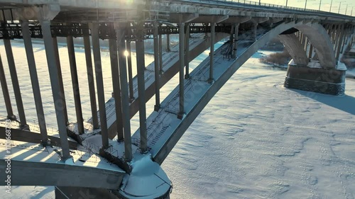 A bridge with snow on it. The bridge is a large structure with a lot of snow on it