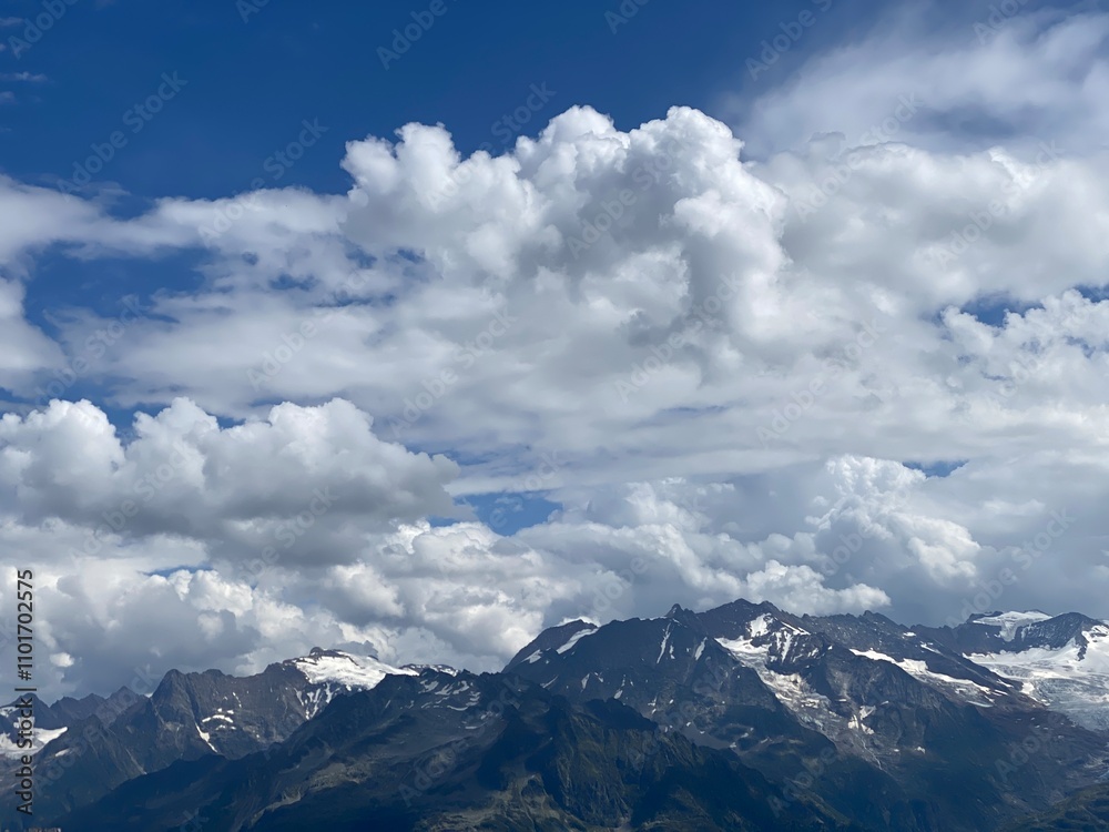 Beautiful photogenic clouds over the Uri Alps massif in the Swiss Alps, Melchtal - Canton of Obwald, Switzerland (Kanton Obwalden, Schweiz) Beautiful photogenic clouds over the Uri Alps massif in the Swiss Alps, Melchtal - Canton of Obwald, Switzerland (Kanton Obwalden, Schweiz)