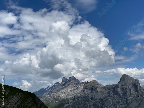 Beautiful photogenic clouds over the Uri Alps massif in the Swiss Alps, Melchtal - Canton of Obwald, Switzerland (Kanton Obwalden, Schweiz) photo