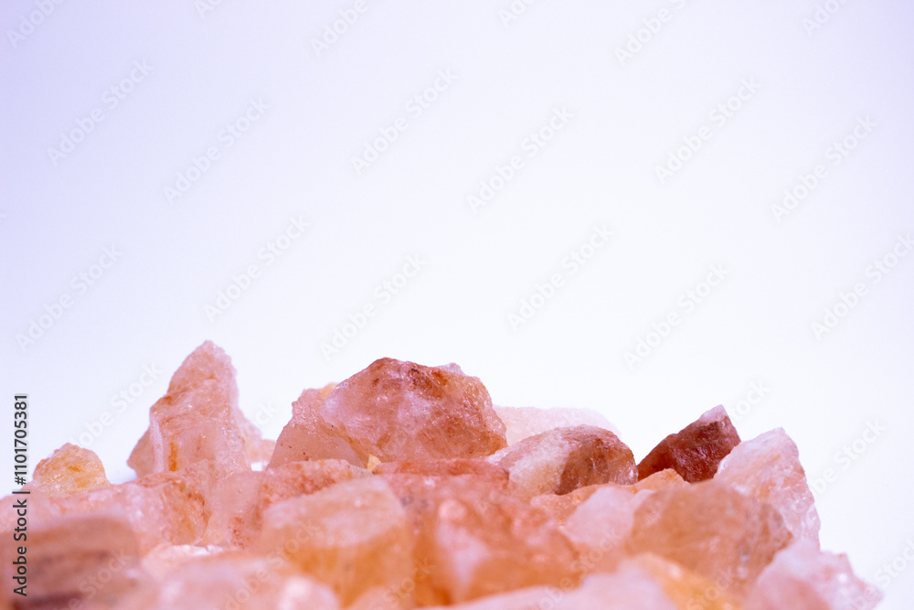 A pile of pink rocks on a white background. The rocks are of different sizes and shapes, and they appear to be arranged in a random pattern. A pile of pink rocks on a white background. The rocks are of different sizes and shapes, and they appear to be arranged in a random pattern.