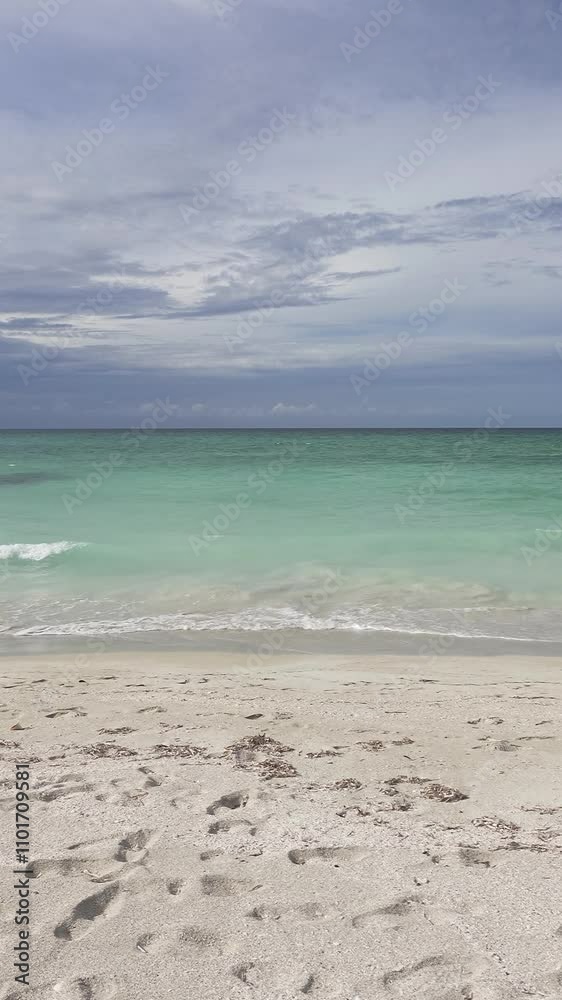 Caribbean sea, Atlantic ocean with mild waves and blue cloudy sky, vertical video Caribbean sea, Atlantic ocean with mild waves and blue cloudy sky, vertical video