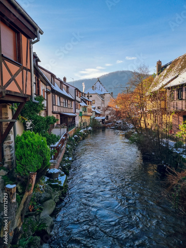 River view in Kaysersberg-Vignoble - colorful half-timbered houses in snow, village near Colmar, Alsace Region, France, one of the most charming villages in France, Alsace Wine Route, Christmas