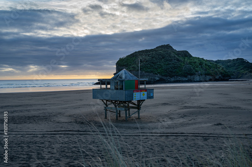 Lifeguard station at the Te Henga surf beach captured at sunset, Auckland, New Zealand