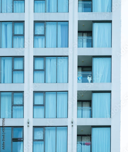 facade of a hotel building with several windows and balconies
