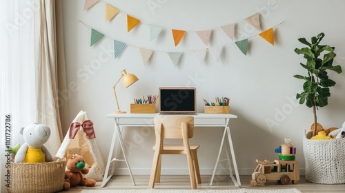 A child's workspace with a laptop, colorful bunting, and toys. A cozy and playful atmosphere.