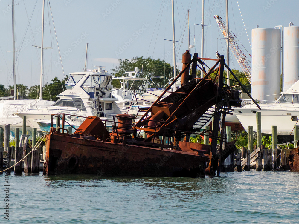 Fototapeta premium old abandoned rusted ship in harbor port of greenport long island new york
