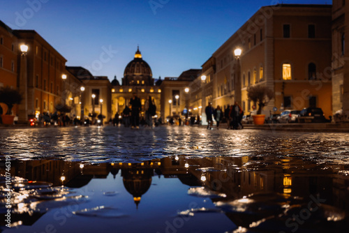 Panoramic night view of St Peter's Basilica with beautiful reflection in Vatican City. Architecture, landmark and attractions of Rome, Italy