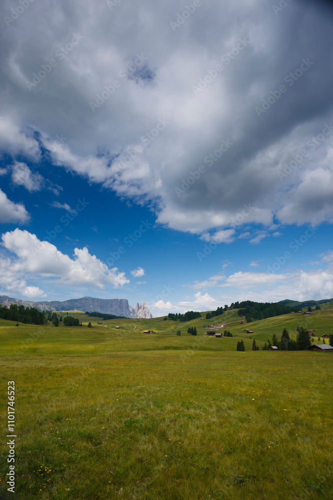 Breathtaking view of the Dolomites with lush meadows and dramatic clouds in Italy Breathtaking view of the Dolomites with lush meadows and dramatic clouds in Italy
