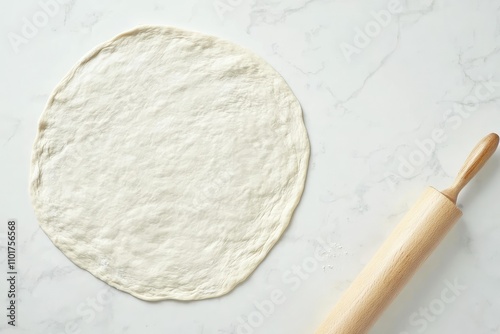 Rolled Pizza Dough with a Rolling Pin on a White Background.