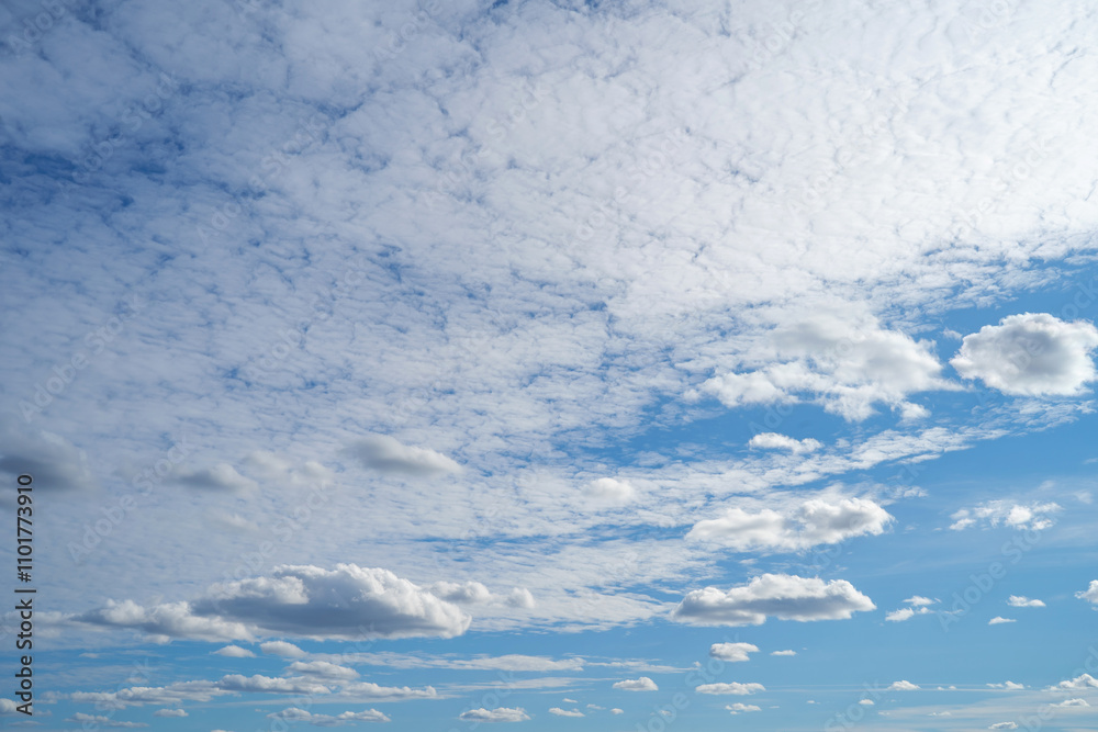 white fluffy clouds standing out against a blue sky white fluffy clouds standing out against a blue sky