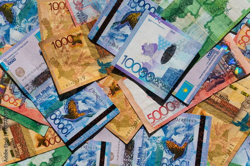 Kazakhstan paper money, banknotes tenge, various denominations. Financial concept: world national currency marke, international trade, economic investment, deposit, credit. Business background