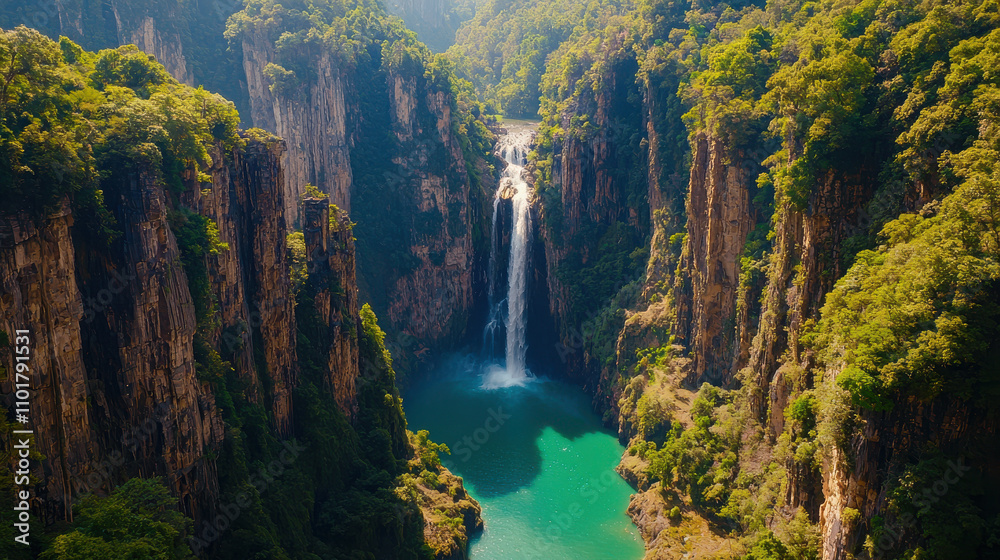 Majestic waterfall cascading into turquoise lagoon surrounded by cliffs