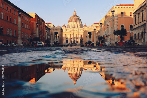 Panoramic view of St Peter's Basilica with beautiful reflection in Vatican City early morning at dawn. Architecture, landmark and attractions of Rome, Italy.