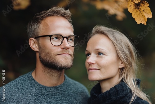 Couple enjoying a quiet moment in a natural setting during autumn season